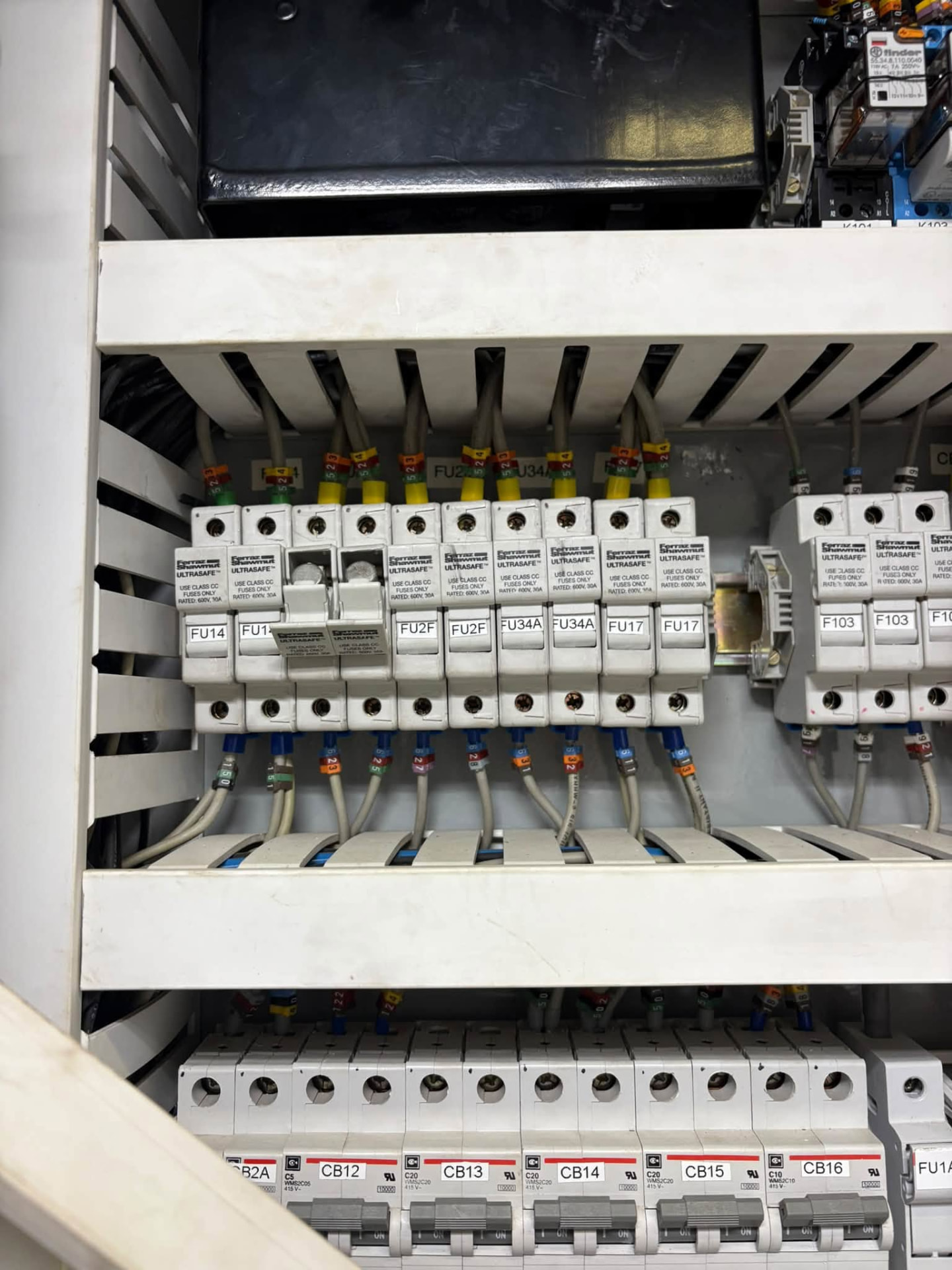 Fuse and breaker panel with labeled Ultrsafe fuse holders and circuit breakers
