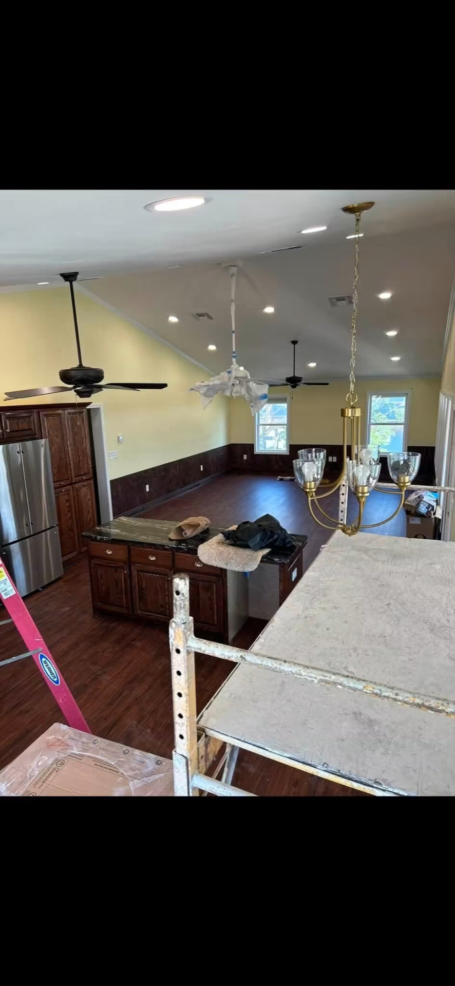 Dining chandelier and recessed lighting installation in progress