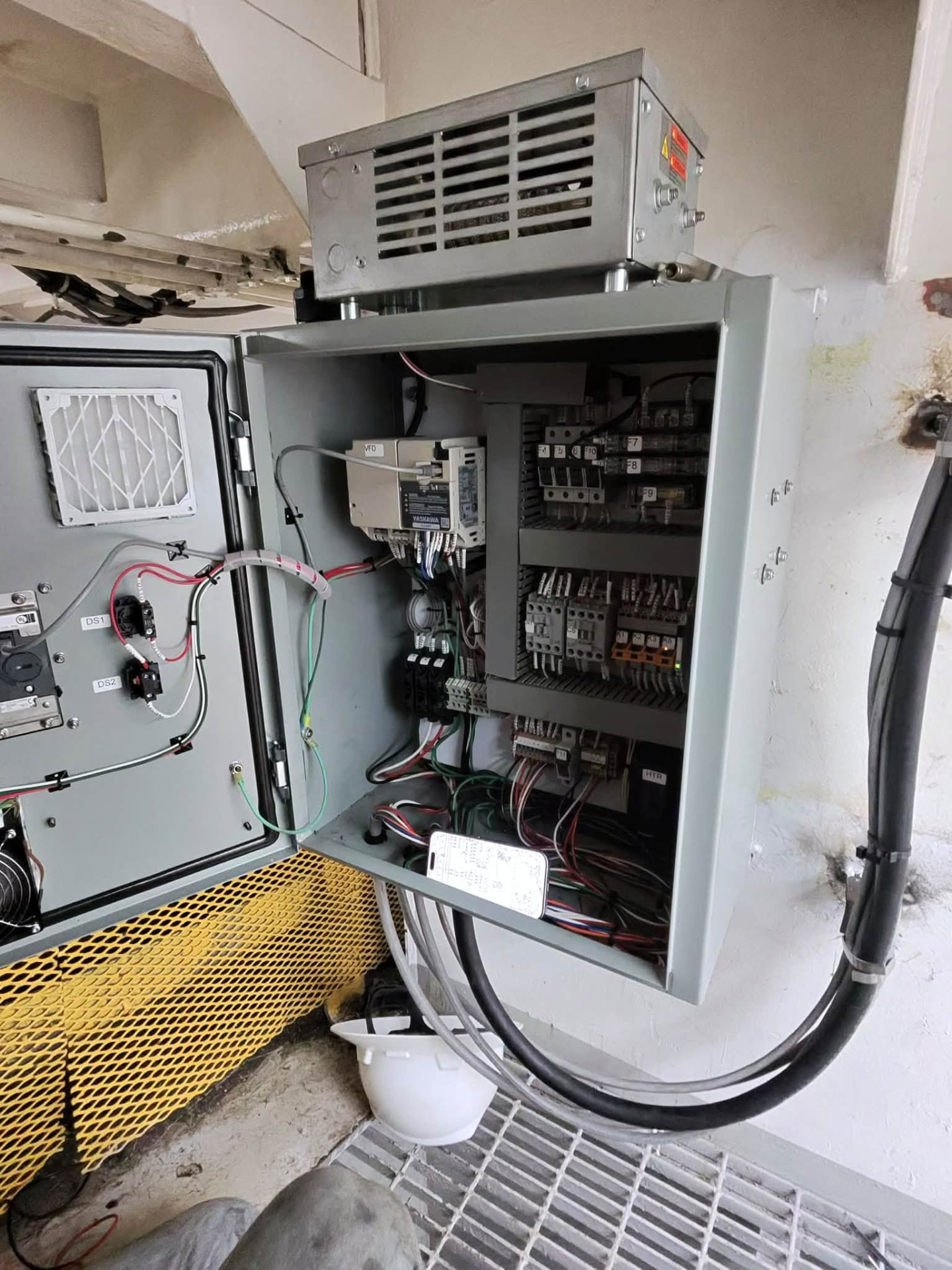 Open VFD cabinet on a vessel with drive, breakers and cable runs