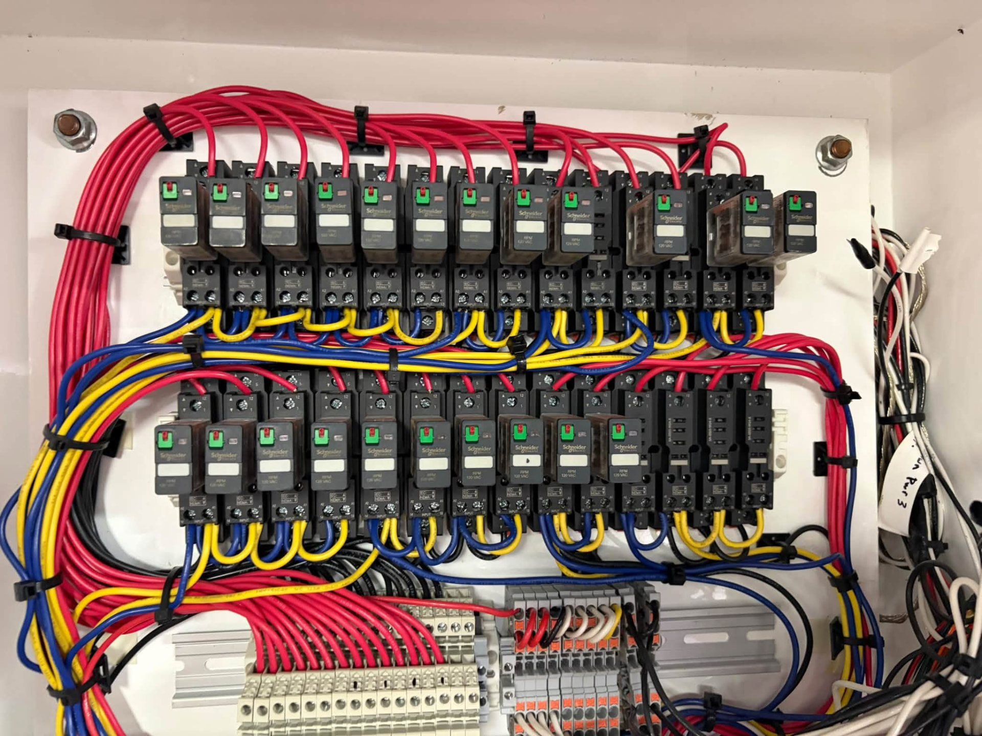 Marine relay panel with neatly dressed control wiring